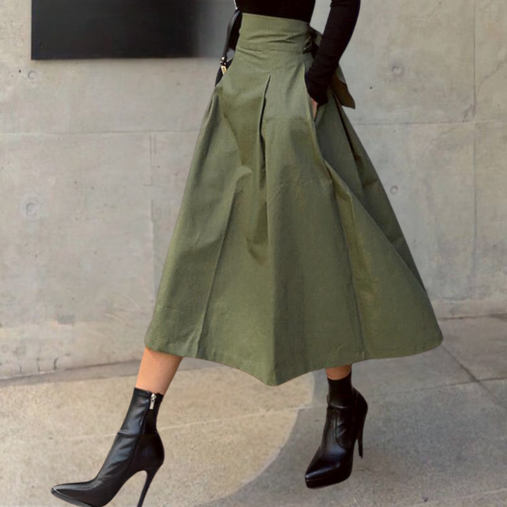 Modieuze zwarte high-waist damesrok met strikdetail die een elegant A-lijn silhouet creëert.