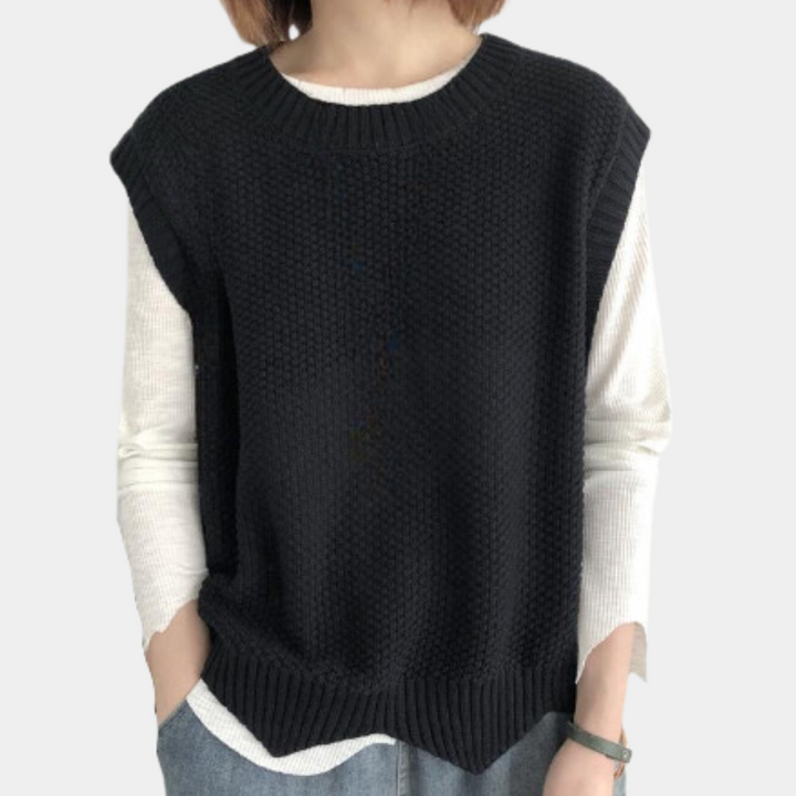 Stijlvolle gebreide dames trui zonder mouwen, losvallend voor gelaagde streetwear look.