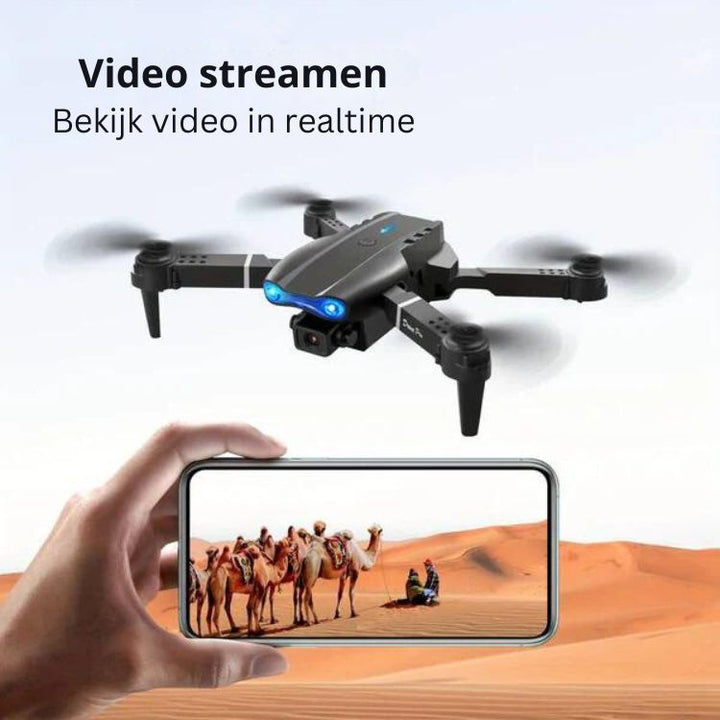 Vliegende AeroVision quadcopter met dubbele 4K camera, klaar voor professionele luchtopnames.