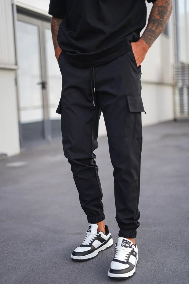 Groene heren cargo broek, een modieuze en praktische keuze voor een frisse, casual look.