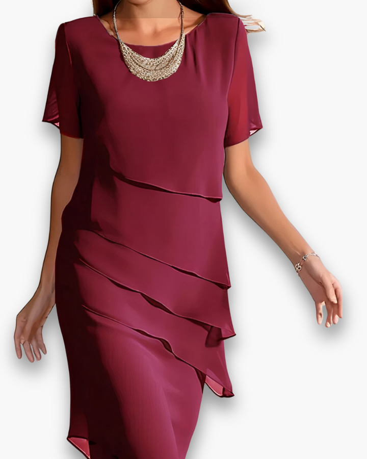 Elegante dames midi jurk met stijlvolle gelaagde details, perfect voor feestelijke gelegenheden en avonden.