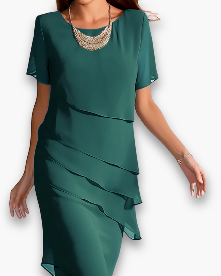 Comfortabele en veelzijdige dames midi jurk met gelaagde rok, ideaal als zomerjurk of feestelijke outfit.