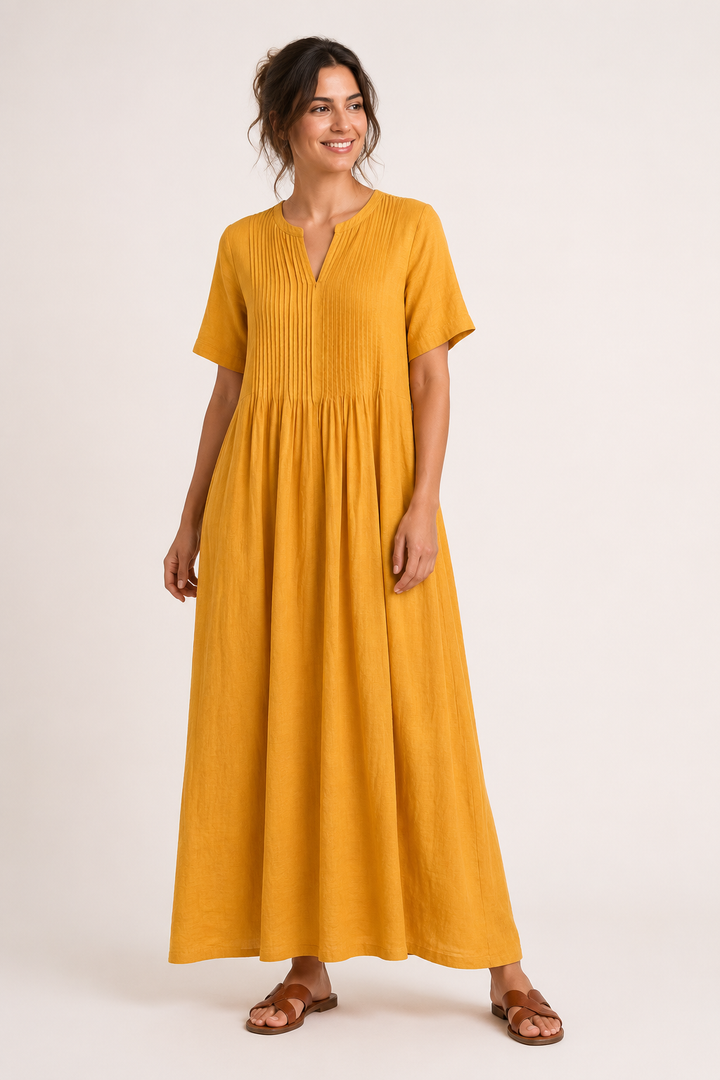 Lange damesjurk voor de zomer met V-hals, korte mouwen en zakken. Een comfortabele en modieuze keuze.