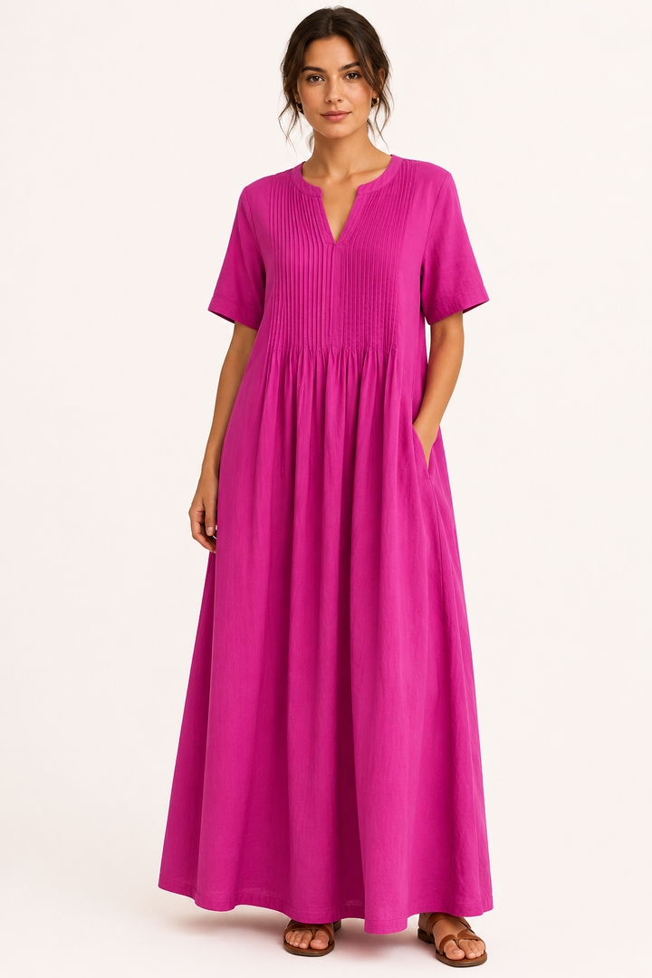 Elegante lange damesjurk met V-hals, korte mouwen en losse pasvorm. Ideaal als zomerse maxijurk of vakantieoutfit.