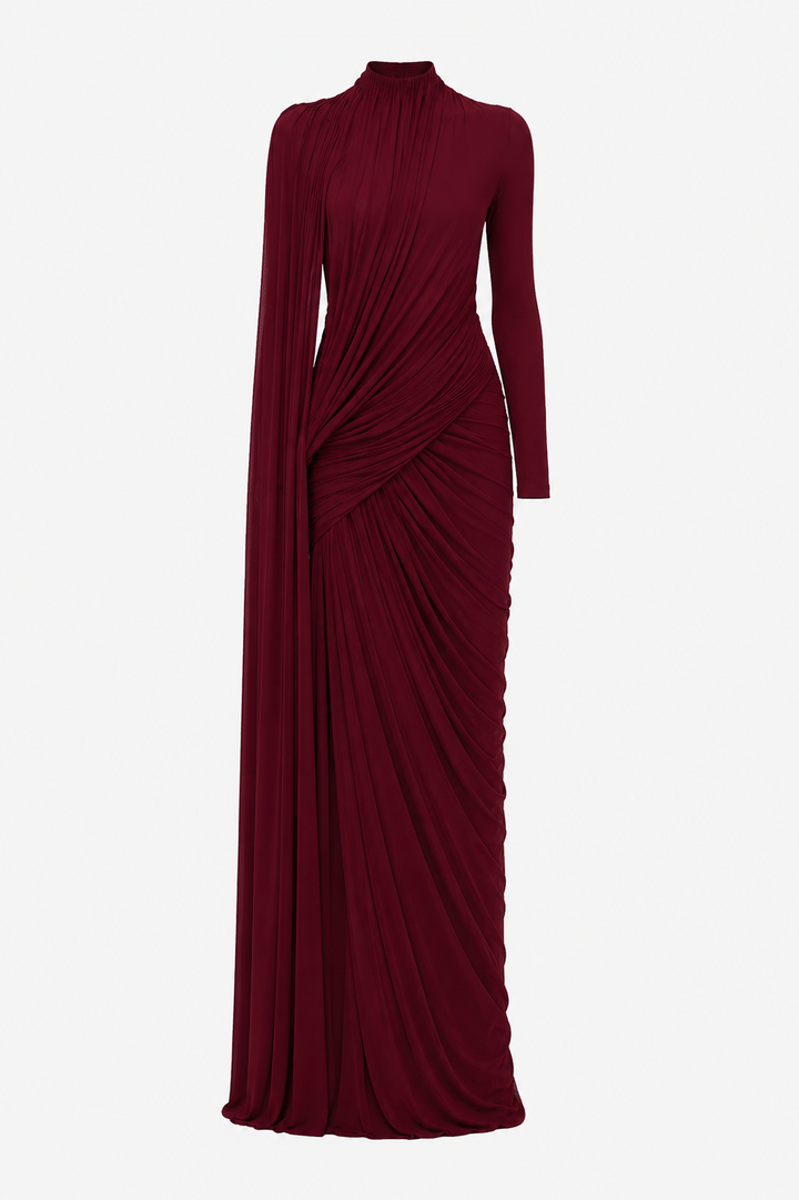 Chique damesjurk met lange mouwen, elegante drapering en een feestelijke uitstraling. Prachtig in groen.