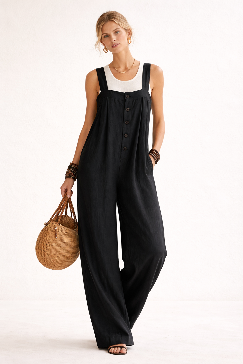 Dames jumpsuit met relaxte pasvorm, lange pijpen en stijlvolle knopen. Ideaal voor dagelijks gebruik of vakantie.