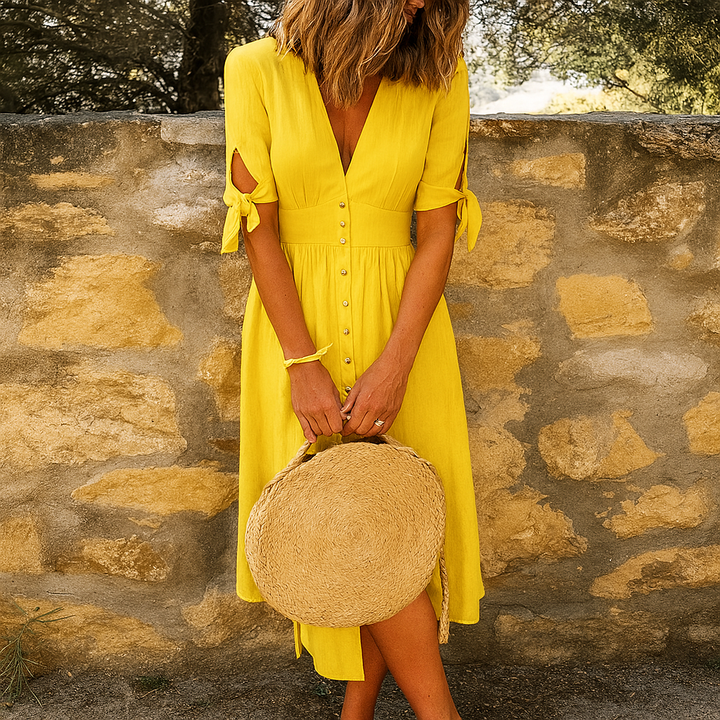 Elegante dames midi-jurk met V-hals en knoopjes. Ademende stof, ideaal voor zomer en lente, comfortabel casual.