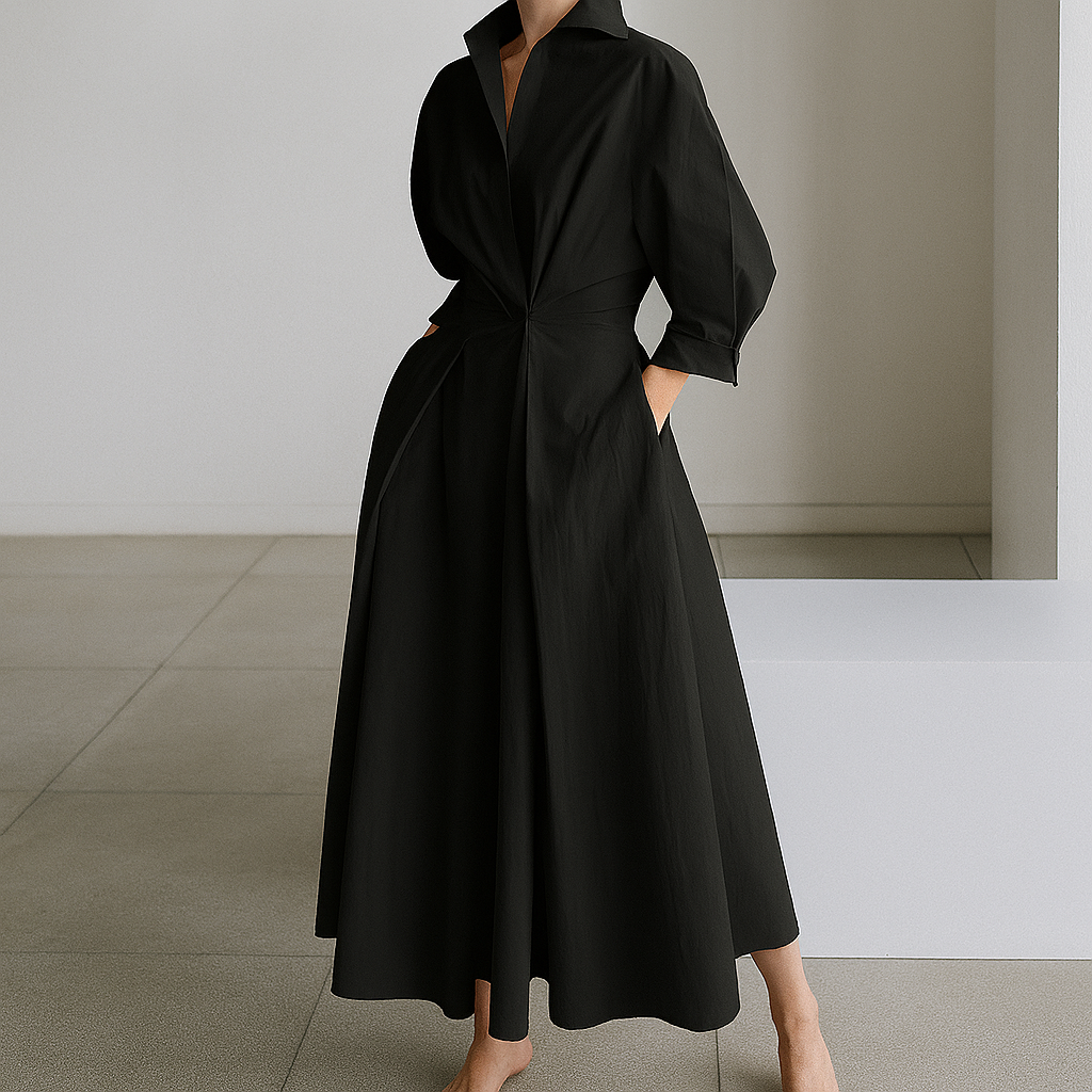 Elegante zwarte dames maxi-jurk met V-hals, vloeiend A-lijn model, perfect voor zomerfeestjes of casual mode.