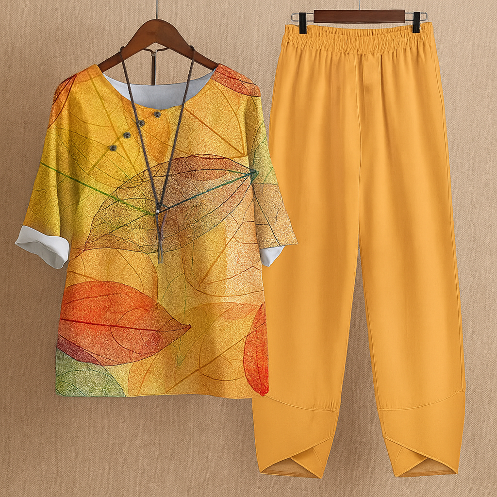 Elegante dames tweedelige set met bloemenprint blouse en comfortabele harembroek, perfect voor de zomer.