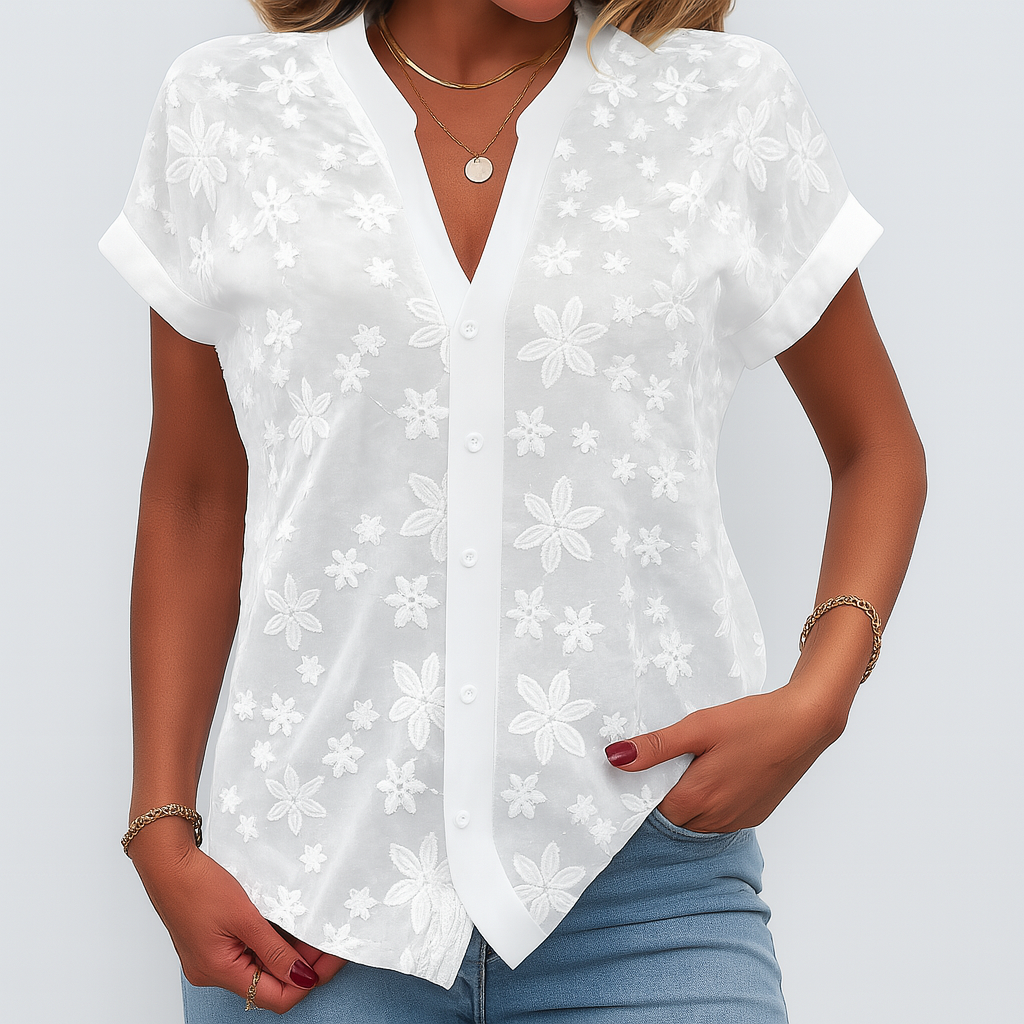 Dames bloemenblouse met korte mouwen, elegante v-hals en witte basis. Perfect voor lente/zomer casual.