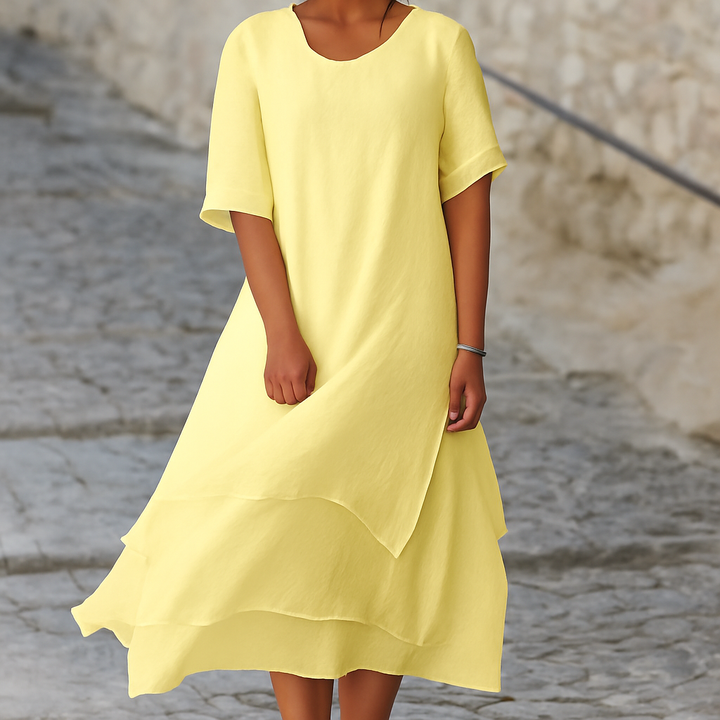 Mouwloze effen polyester midi jurk voor dames, ideaal voor zakelijke of feestelijke gelegenheden.