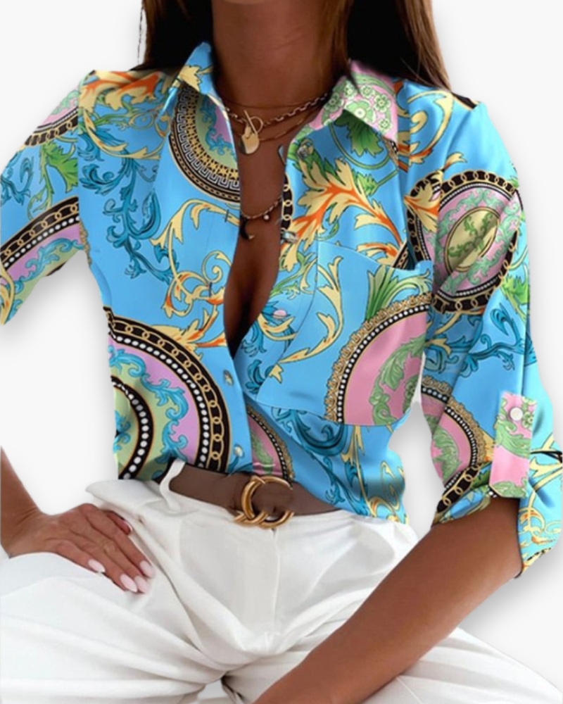 Modieuze damesblouse met levendige abstracte moderne print, een echte eyecatcher.