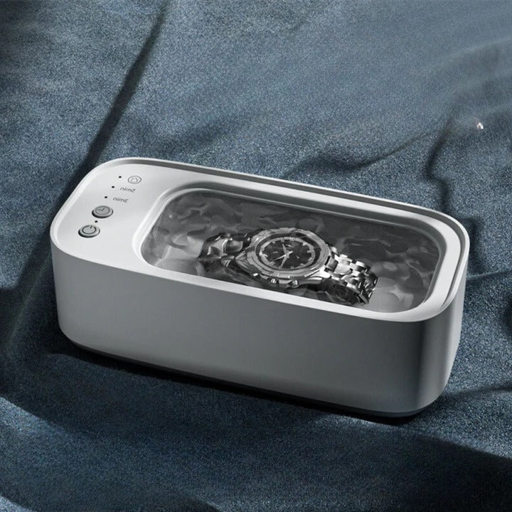 Compacte ultrasone reiniger voor sieraden, brillen en horloges. Zorgt voor sprankelende glans.