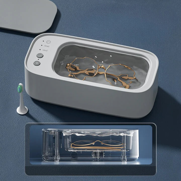 Geavanceerde ultrasone reiniger gadget voor moeiteloze schoonmaak van brillen, sieraden en accessoires.
