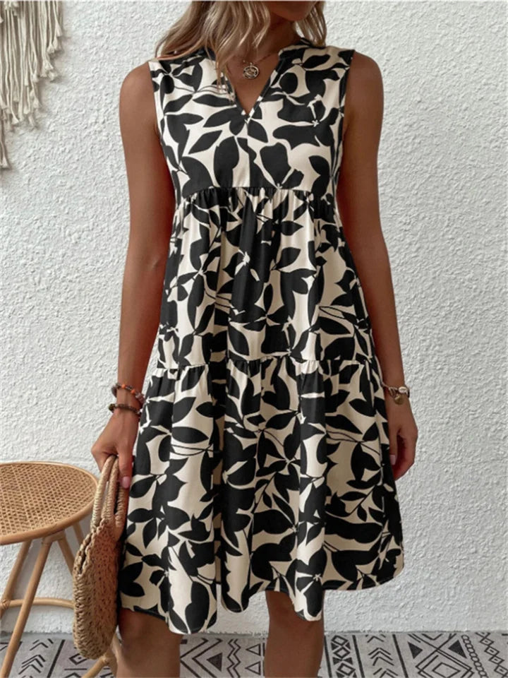 Trendy bloemige midi damesjurk, combineert comfort en stijl, essentieel voor je zomercollectie.