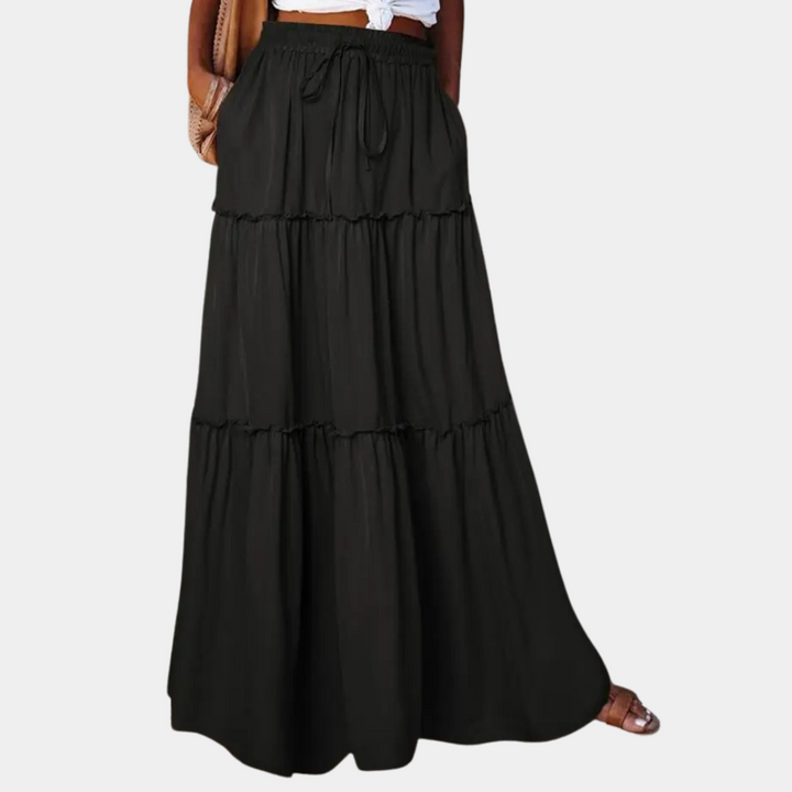 Elegante lange bohemian damesrok met vloeiende pasvorm; perfecte zomerse maxi rok voor een stijlvolle look.
