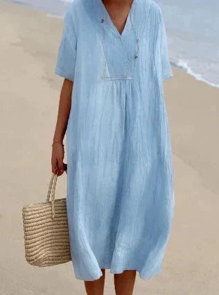 Vrouwelijk ontwerp van een elegante midi jurk, perfect als comfortabele zomerse kleding.