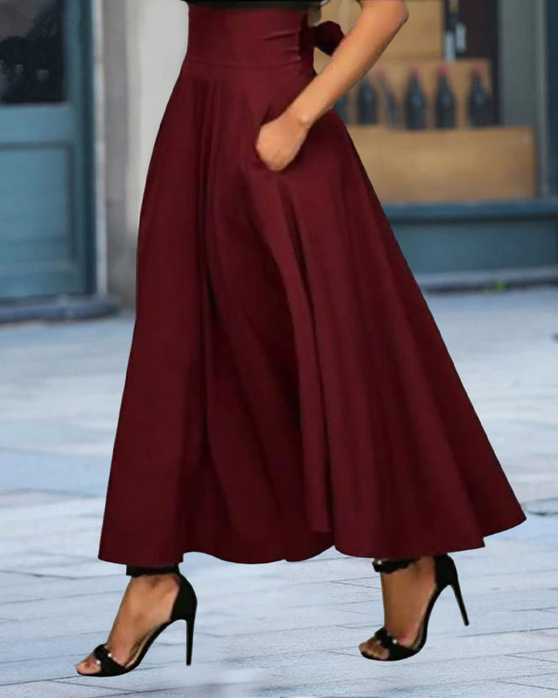 Grijze stijlvolle dames rok, lang model met hoge taille, veelzijdig voor elke gelegenheid.