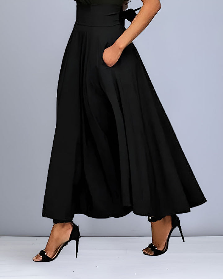Rode feestrok voor dames, elegant en lang met hoge taille, een opvallende keuze.