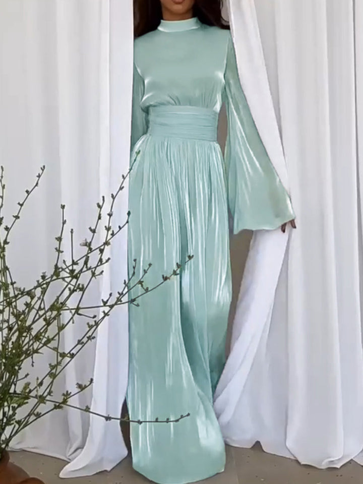 Stijlvolle maxi damesjurk met chique strikceintuur, ideaal als feestjurk of galajurk.