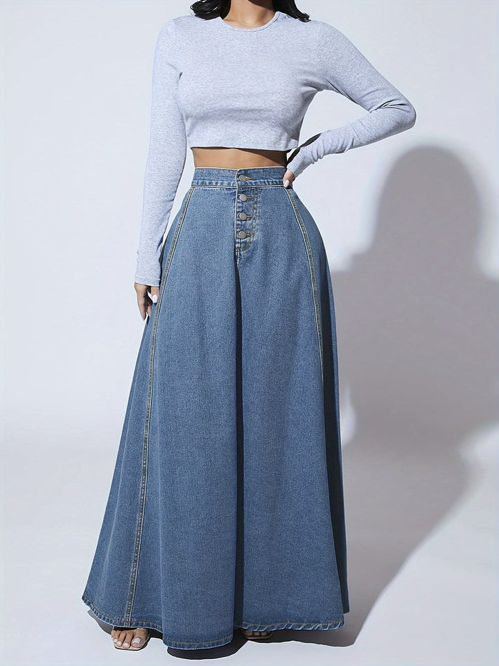 Flatterende blauwe maxi spijkerrok met hoge taille, uitlopend model, voor een stijlvolle vrouwelijke mode-uitstraling.