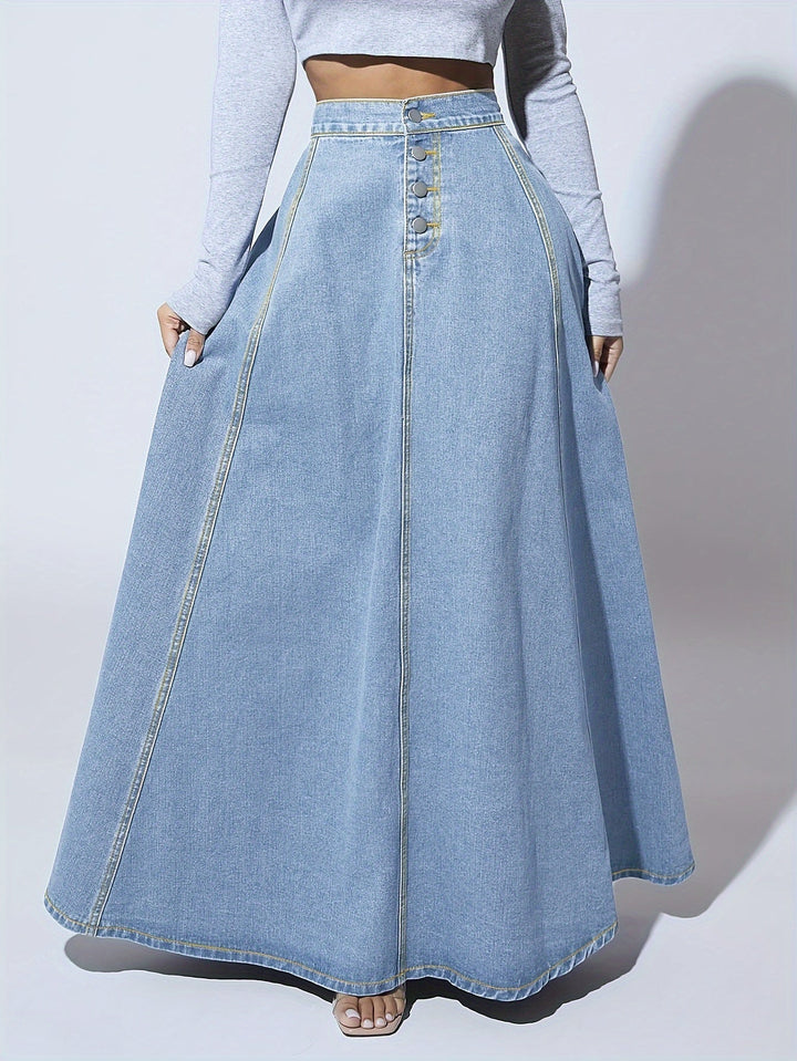 Trendy blauwe dames spijkerrok met hoge taille en uitlopende snit, een flatterende maxi rok voor zomerse elegantie.
