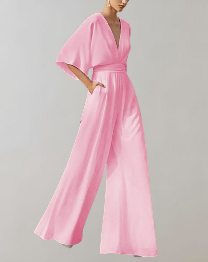 Trendy dames jumpsuit met wijde pijpen en diepe V-hals, veelzijdig voor zowel dag als avond. Elegant en comfortabel.