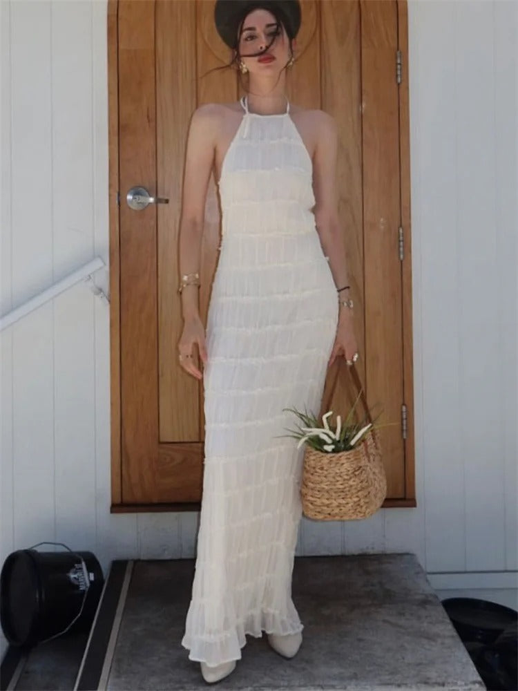 Modieuze openrug halter maxijurk voor dames, elegant en vrouwelijk, verkrijgbaar in diverse kleuren.