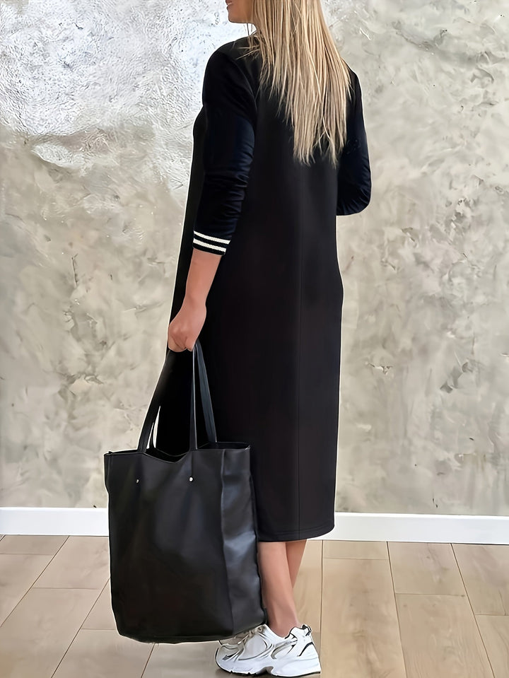 Modieuze dames midi jurk met V-hals en subtiele strepen. Ideale elegante jurk voor diverse gelegenheden.