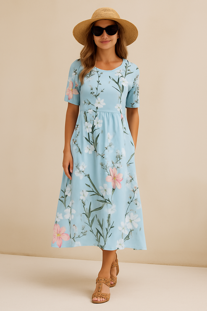 Levendige bloemen midi-jurk voor dames met vloeiend patroon. Elegante, comfortabele zomerjurk, ideaal voor casual.