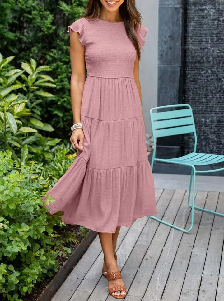 Casual-elegante damesjurk met vlindermouwen; een must-have voor de zomer en vrouwenmode.