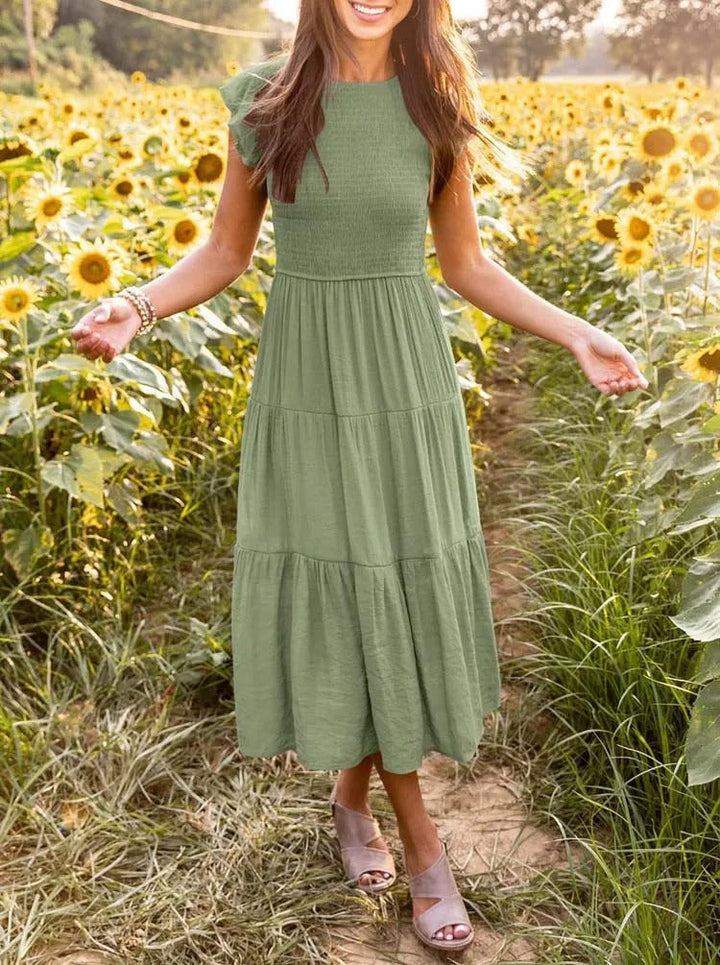 Comfortabele midijurk voor dames, voorzien van flatterende vlindermouwen, casual en stijlvol.