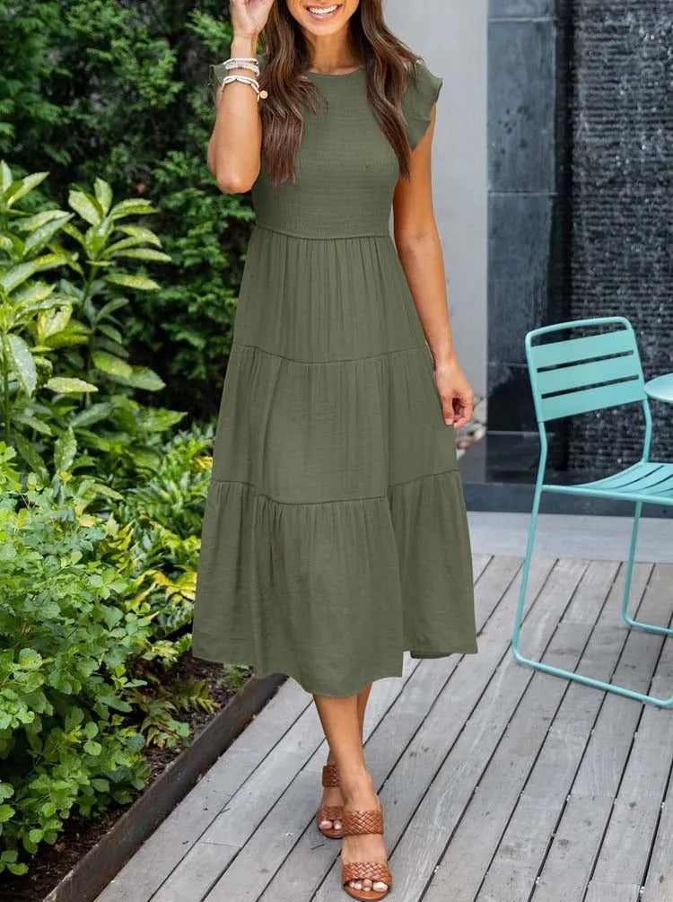 Vrouwenmode: casual damesjurk, midi-lengte, met unieke vlindermouwen voor zomerse dagen.