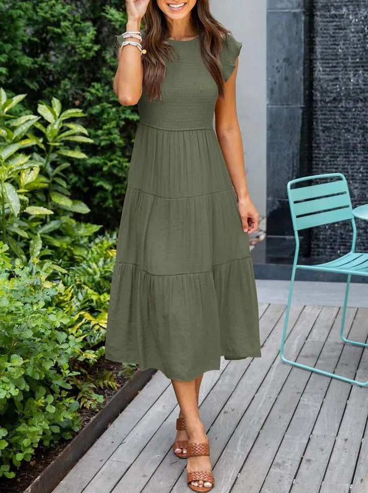 Vrouwenmode: casual damesjurk, midi-lengte, met unieke vlindermouwen voor zomerse dagen.