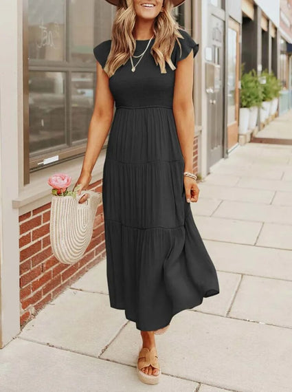 Zomerse midi-jurk voor vrouwen met comfortabele pasvorm en modieuze vlindermouwen.