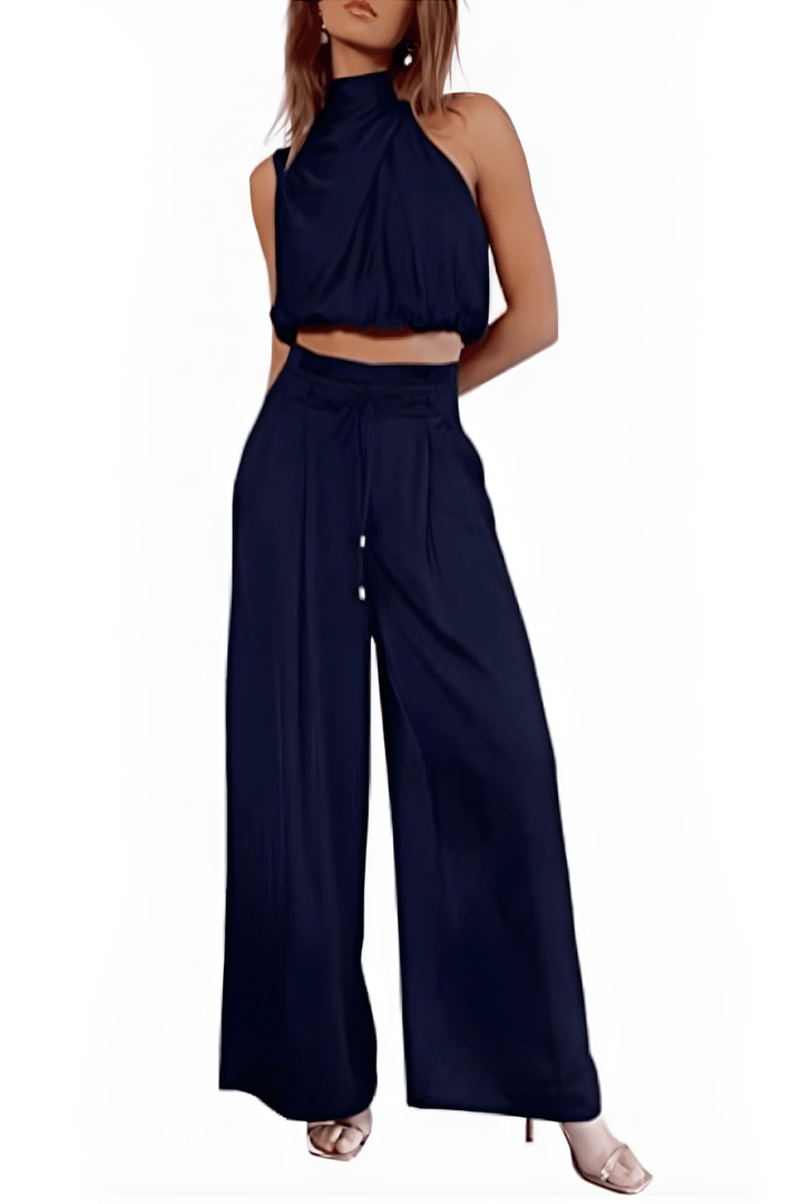 Veelzijdige dames set: mouwloze top en broek. Gemakkelijk te stylen voor zowel casual als chique gelegenheden.
