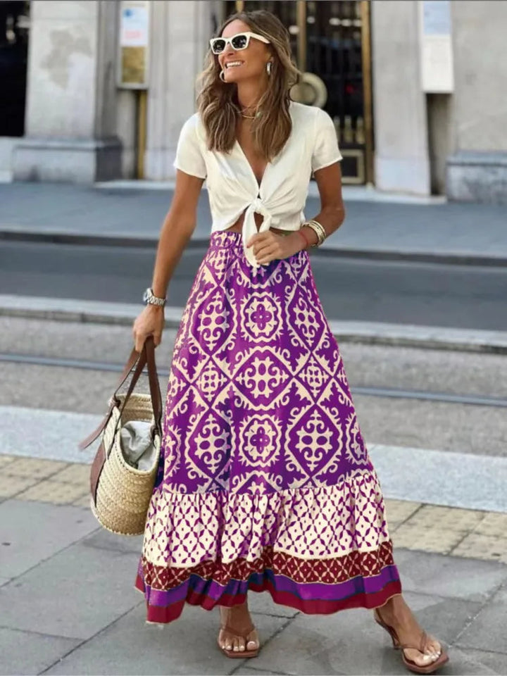 Elegante dames midi rok Liora met speelse retro print en vrouwelijke ruches, ideaal voor een vintage zomerstijl.