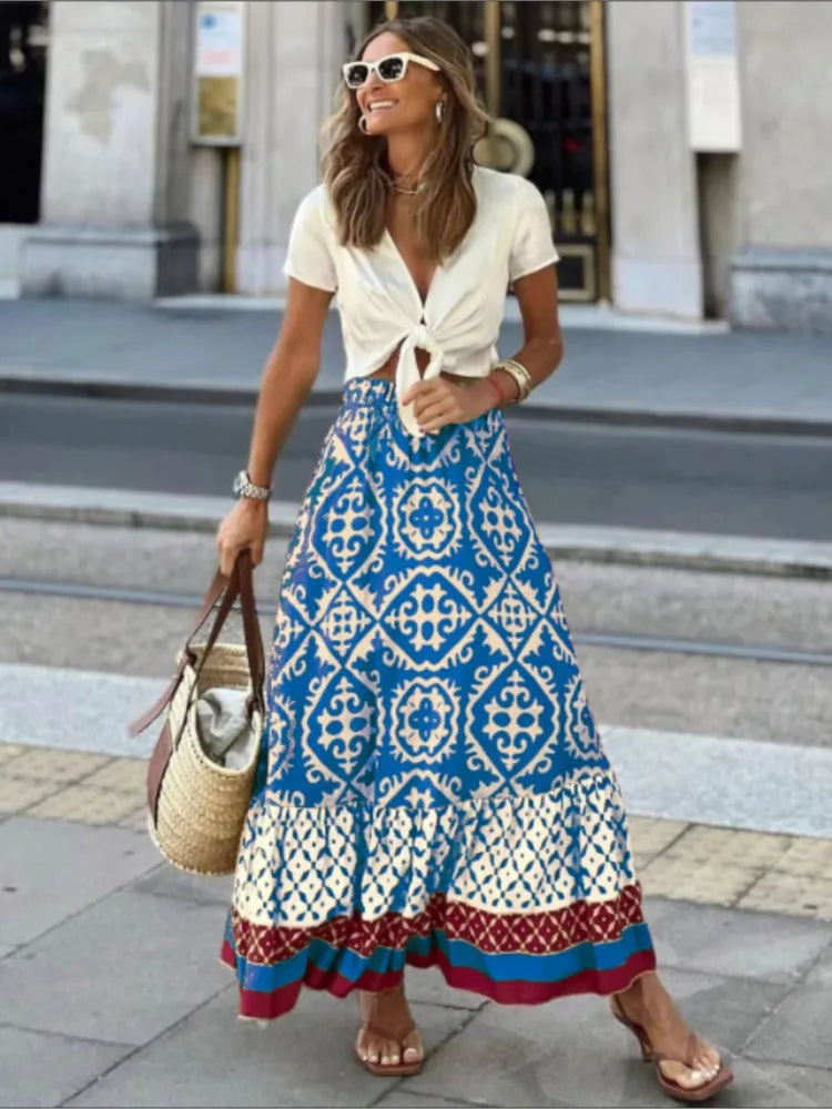 Comfortabele, luchtige Liora dames midi rok met kleurrijke retro print, perfect als zomerrok voor strand of dagelijkse outfit.