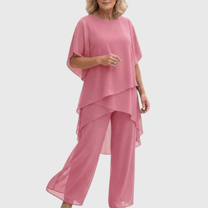 Lichtgewicht, comfortabele tweedelige dames set met asymmetrische top en wijde palazzo broek. Perfect voor zomer.