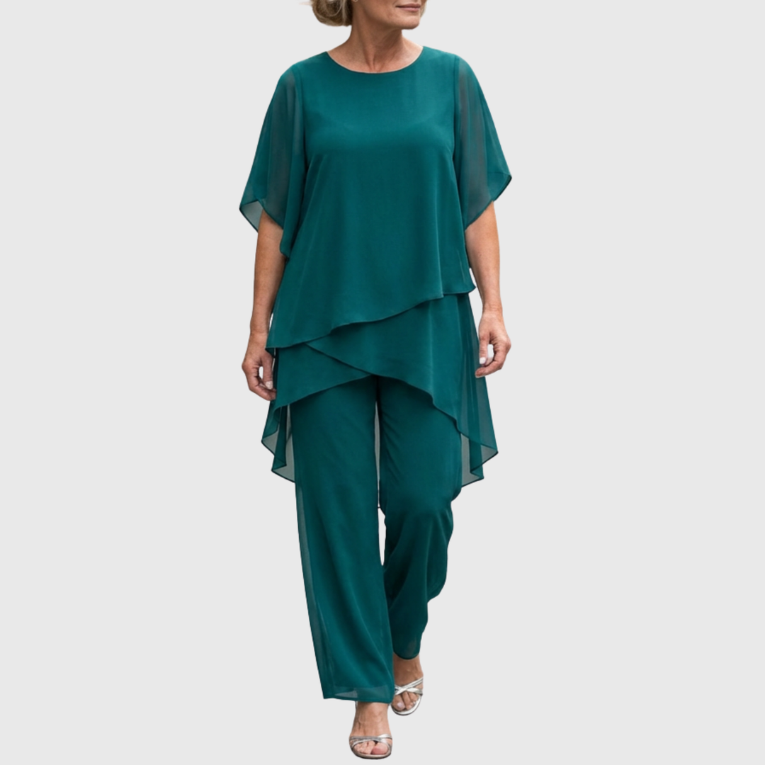 Modieuze zomeroutfit: tweedelige dames set met asymmetrische top en elegante palazzo broek voor stijlvol comfort.