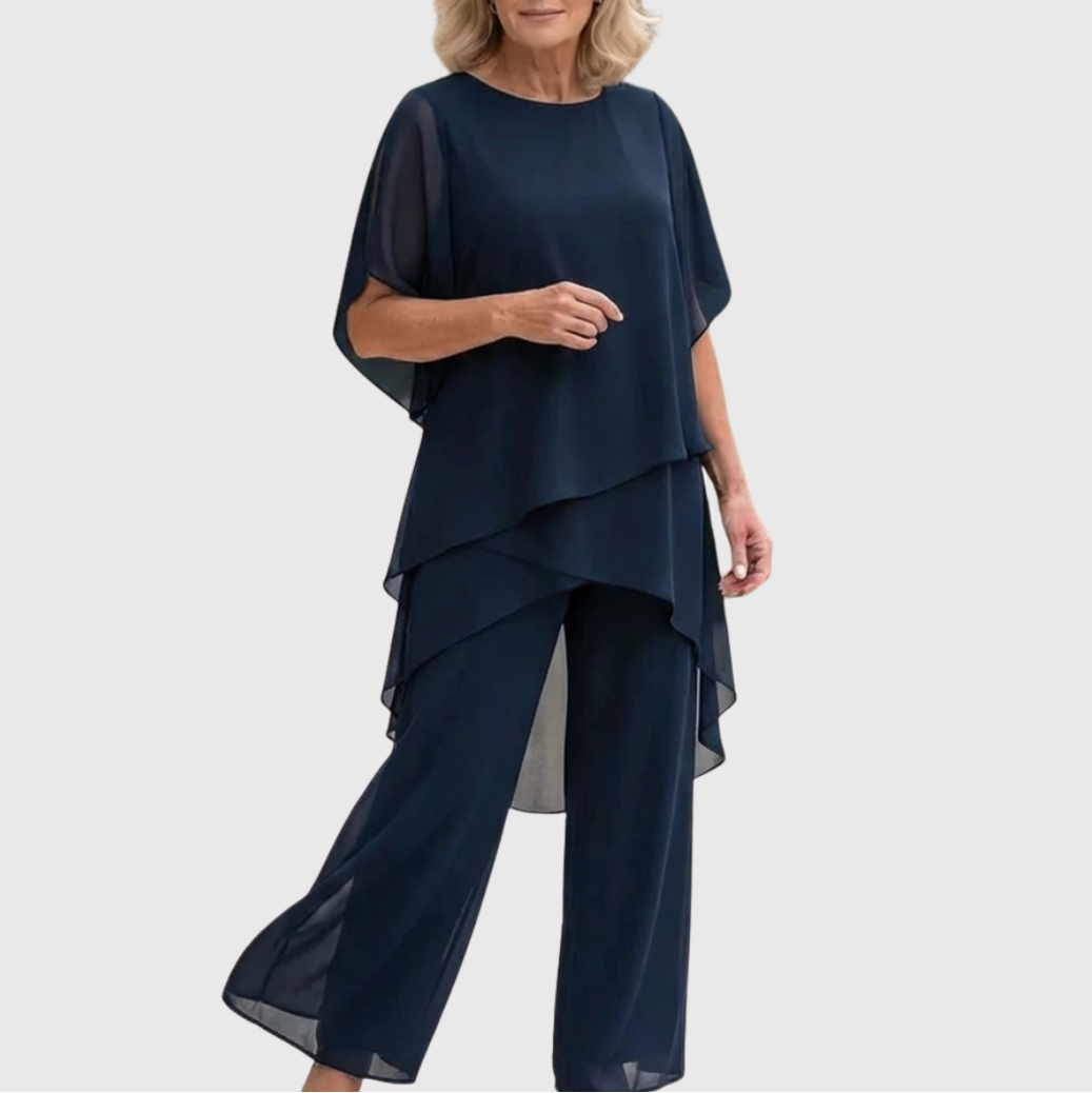 Dames tweedelige set met asymmetrische top en palazzo broek. Elegante, comfortabele zomeroutfit voor vrouwen.