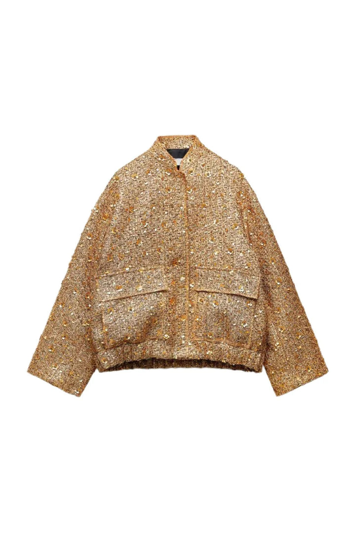 Sprankelende gouden glitterjas voor dames, kort en oversized met kraag. Ideaal voor statement herfst- en voorjaarsmode.
