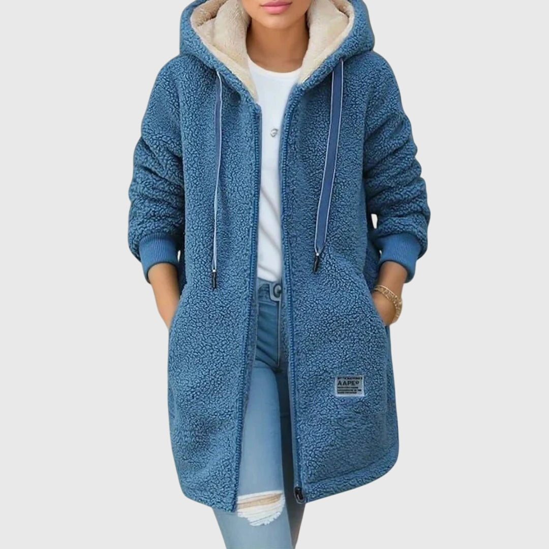 Lange dames teddy capuchonjas met rits, perfect voor een comfortabele en warme winteroutfit.