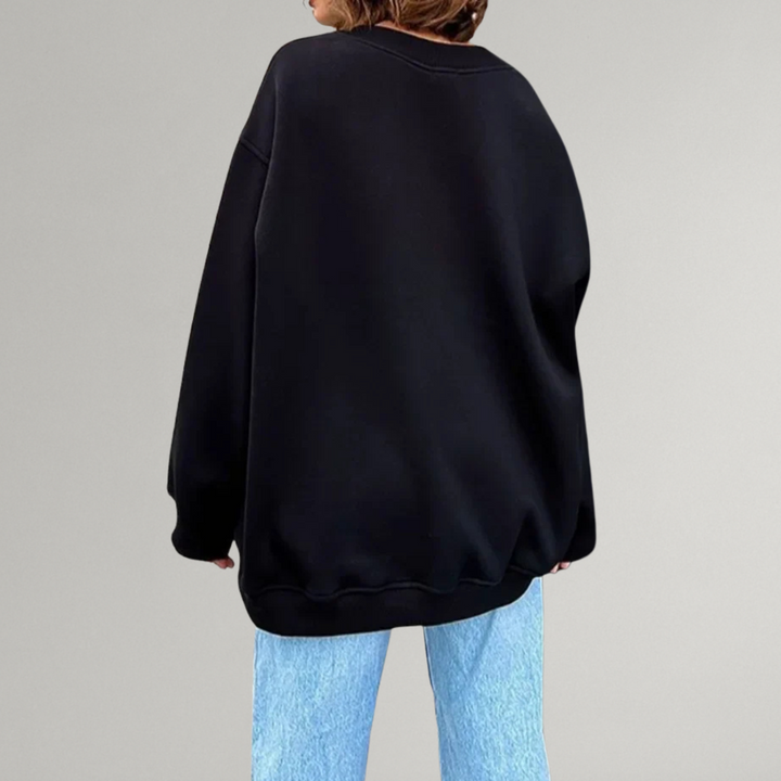 Zijaanzicht trendy oversized dames sweater, lange mouwen, relaxte pasvorm, ideaal voor herfst/winter comfort en stijl.