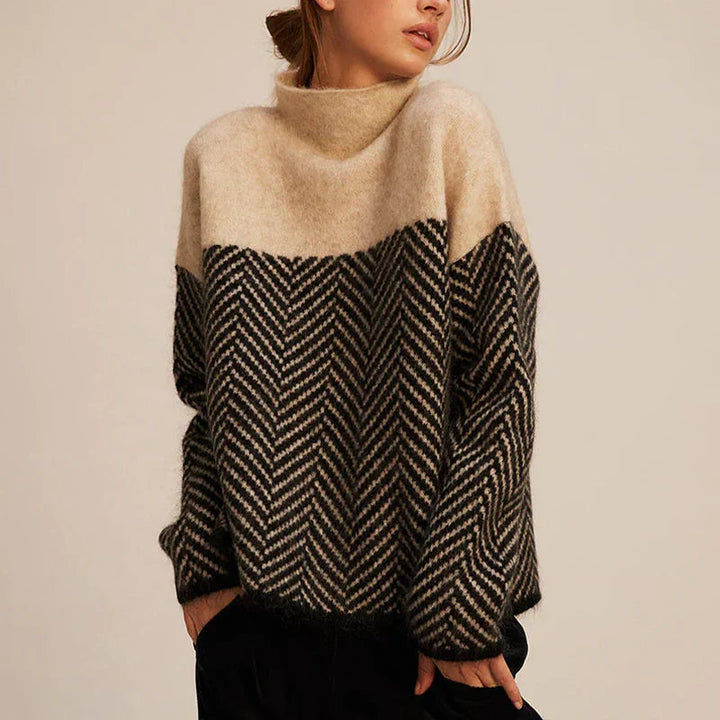 Dames coltrui met stijlvol visgraatpatroon, comfortabel en gebreid. Perfecte relaxed fit voor herfst/wintermode.