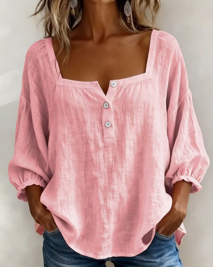 Damesblouse met elegante vierkante hals en stijlvolle pofmouwen, perfect voor zomer of lente.