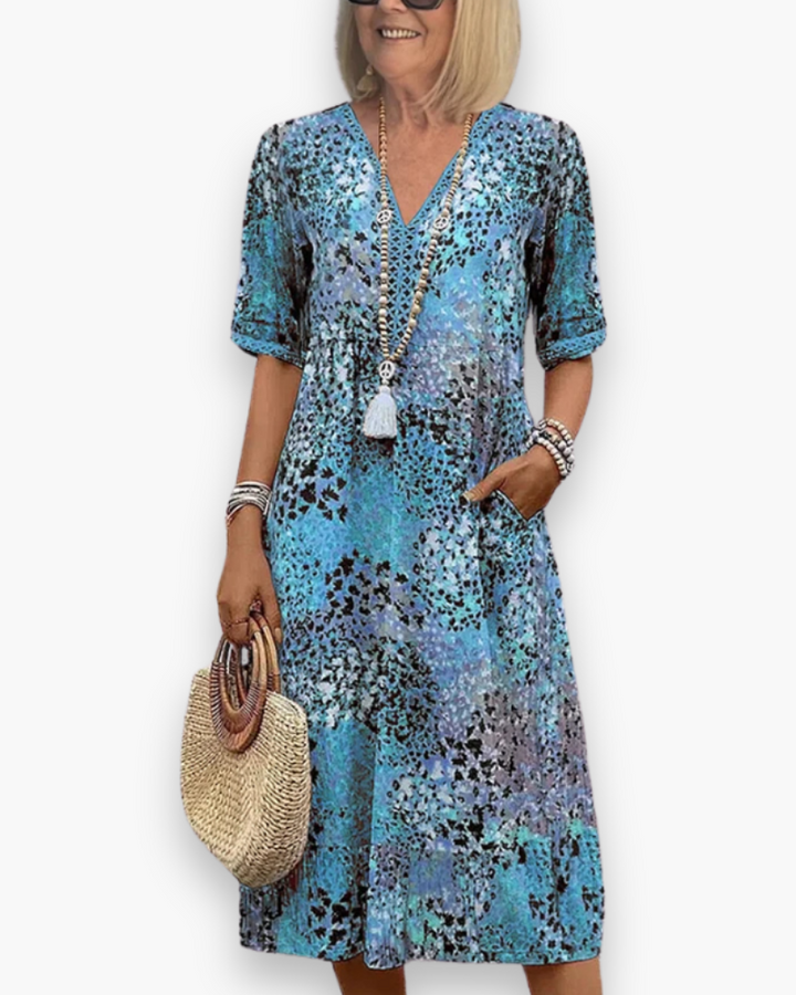 Midi-jurk voor dames met vrolijke bloemenprint, ideaal als casual zomerjurk, strandjurk of dagelijkse kleding.