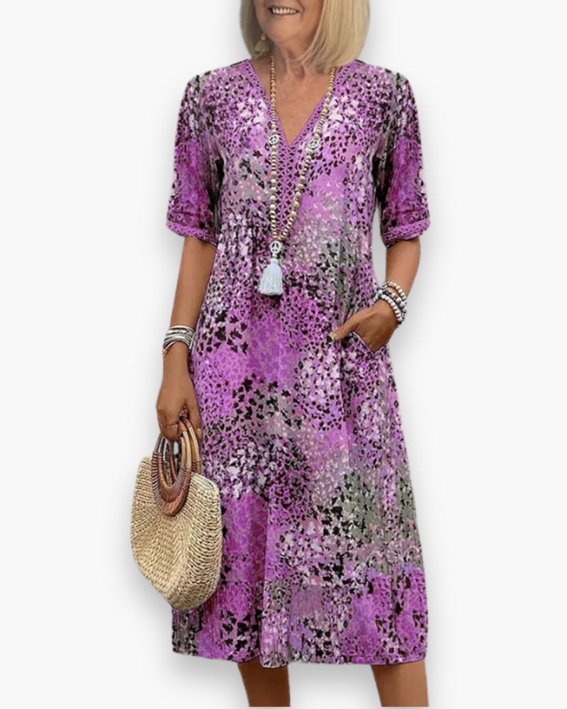 Stijlvolle dames midi-jurk met bloemenprint, uitermate geschikt als elegante zomerjurk of luchtige strandjurk.