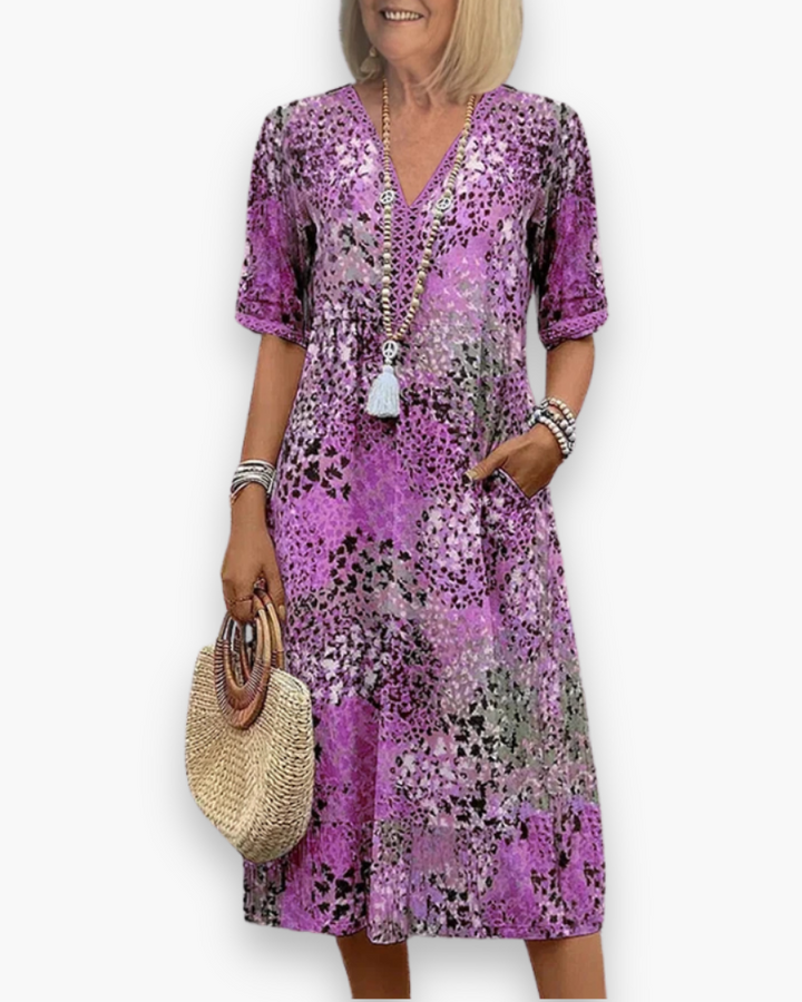 Stijlvolle dames midi-jurk met bloemenprint, uitermate geschikt als elegante zomerjurk of luchtige strandjurk.