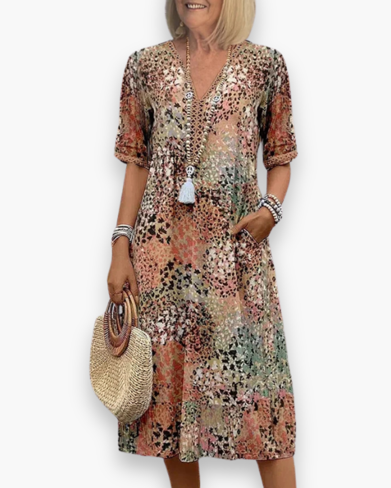 Veelzijdige dames midi-jurk met V-hals en bloemenprint, ideaal voor een elegante en comfortabele look.